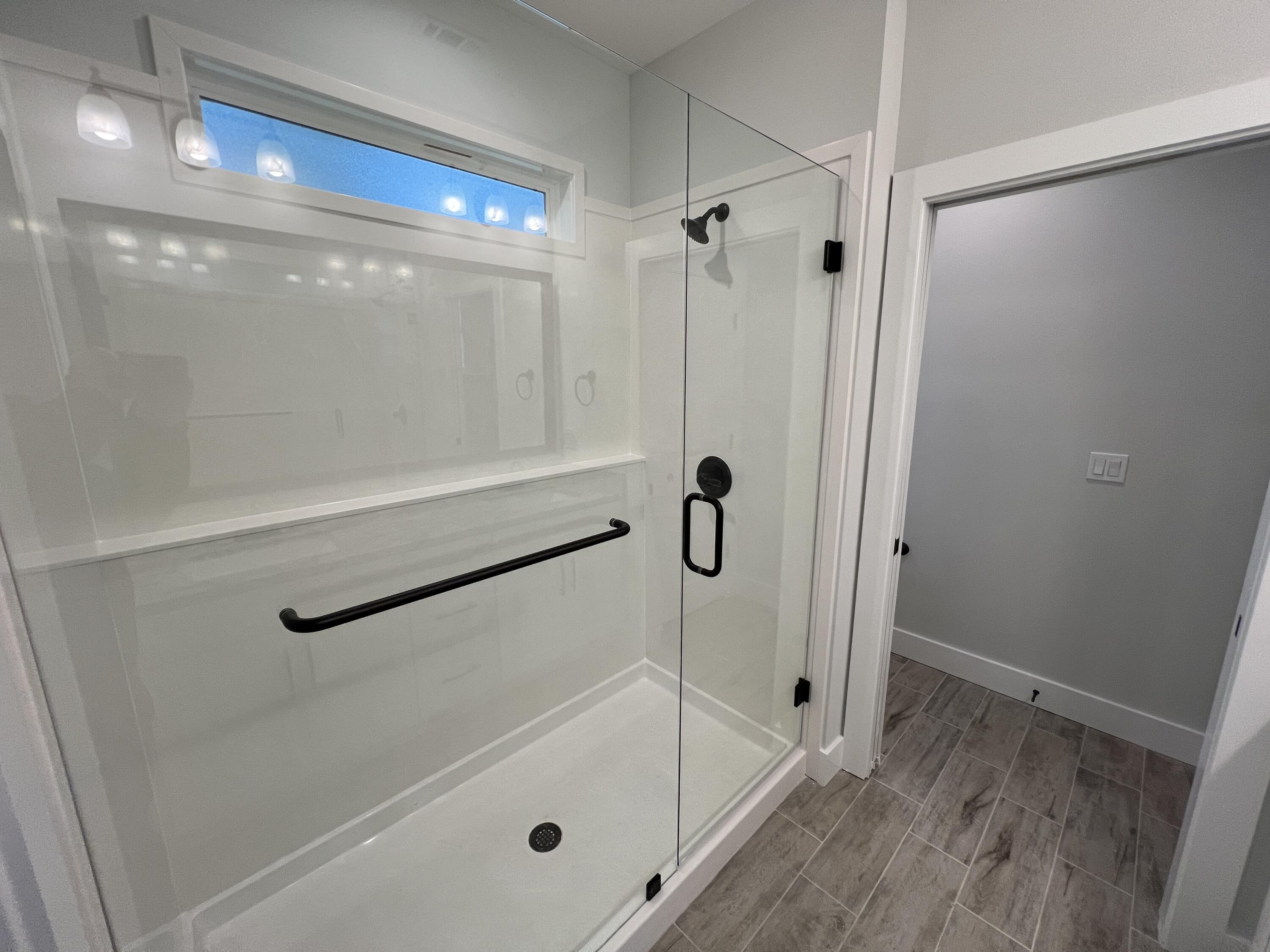 1491 Cat-Mar Road Niceville, FL 32578 - Photo 21 of 30 a bathroom with a glass shower door