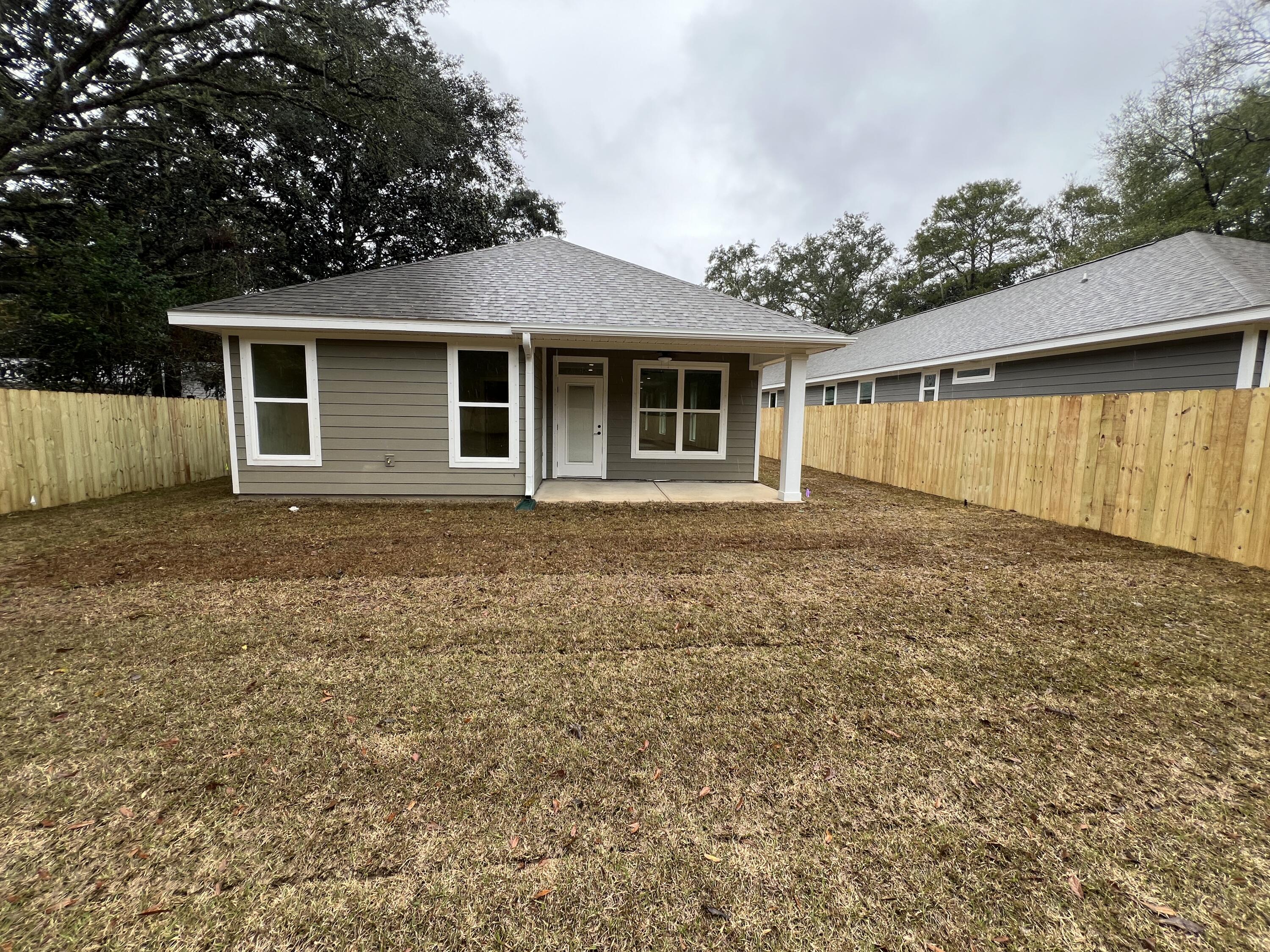 1491 Cat-Mar Road Niceville, FL 32578 - Photo 27 of 30 front view of a house with a yard