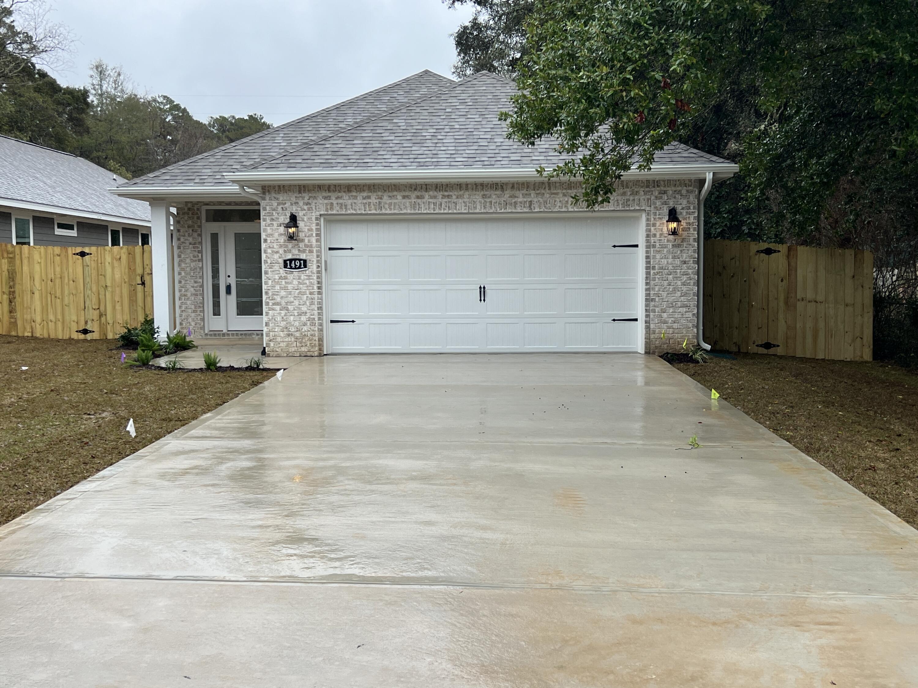 1491 Cat-Mar Road Niceville, FL 32578 - Photo 30 of 30 a view of a house with a garage