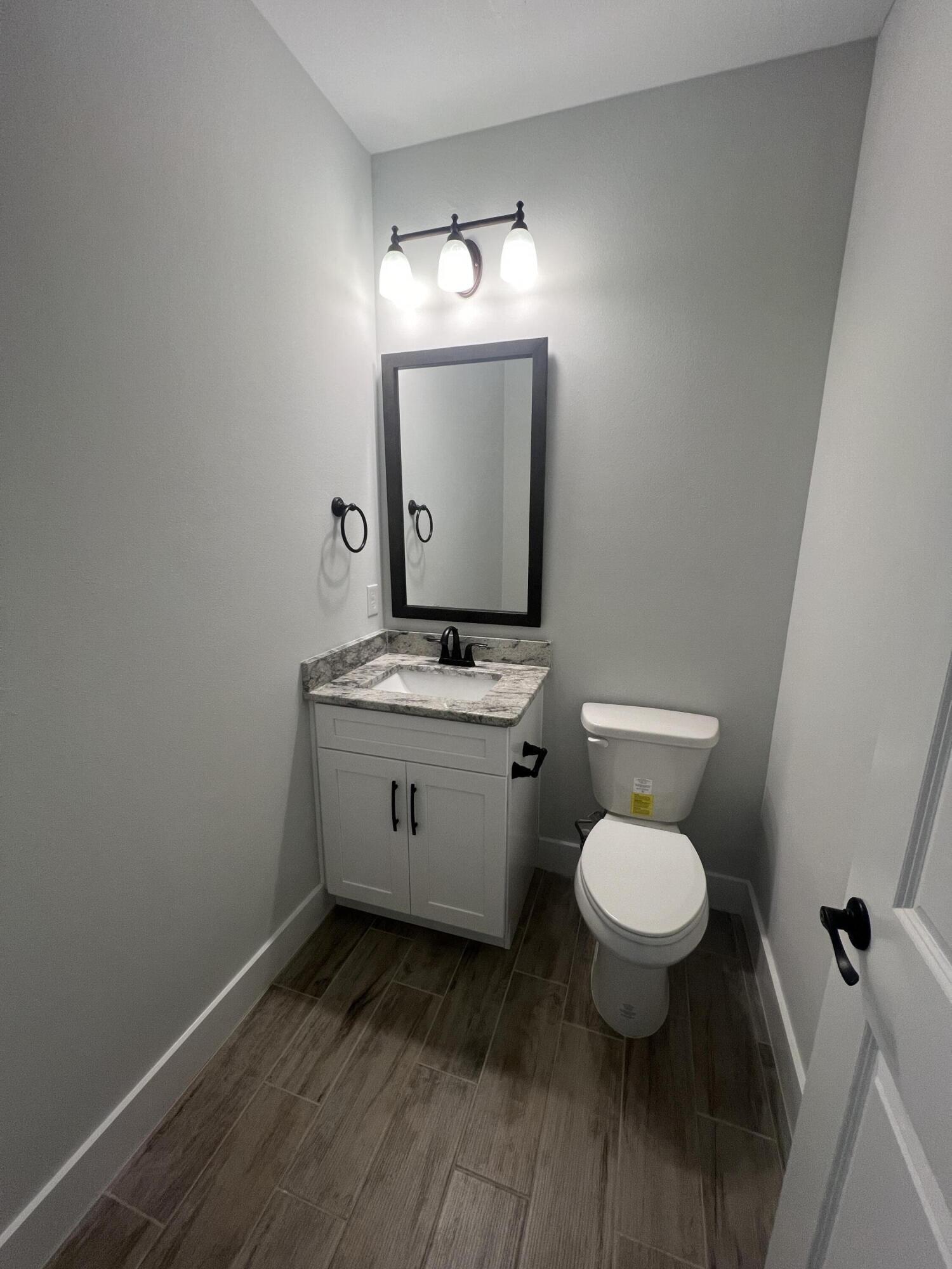 1491 Cat-Mar Road Niceville, FL 32578 - Photo 9 of 30 a bathroom with a toilet sink and mirror