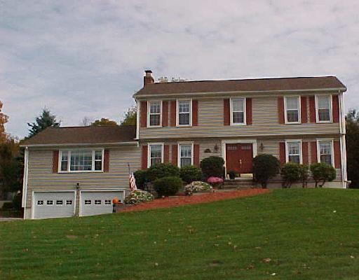 16 Spinning Wheel Road Monroe, CT 06468 - Photo 1 of 1 a front view of a house with a yard