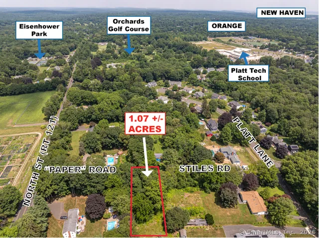 a sign that is sitting in a flower in a garden