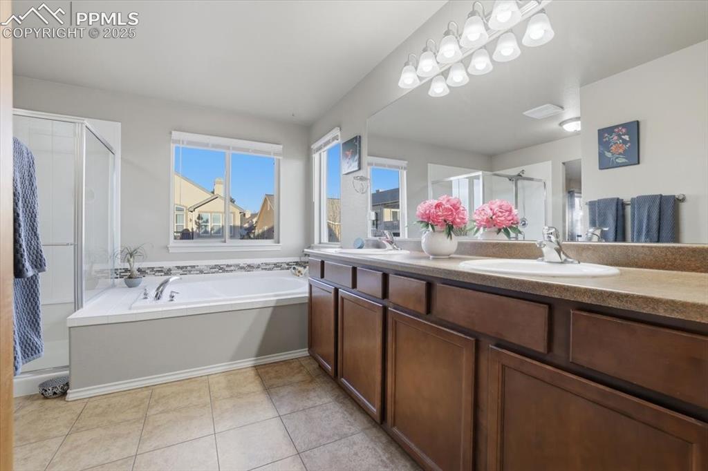 2374 Cinnabar Road Colorado Springs, CO 80921 - Photo 34 of 47 Dual vanities and LOTS of counter space make this an easy spot for two people to start and end the day together.