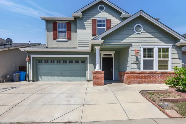 a view of a house with large windows