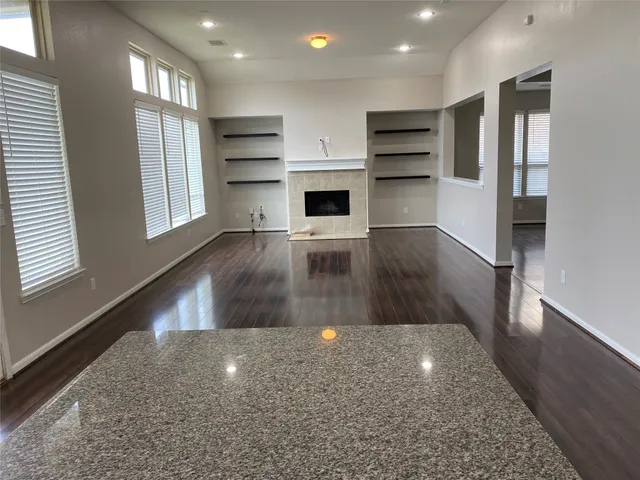 a view of kitchen and a window in a room