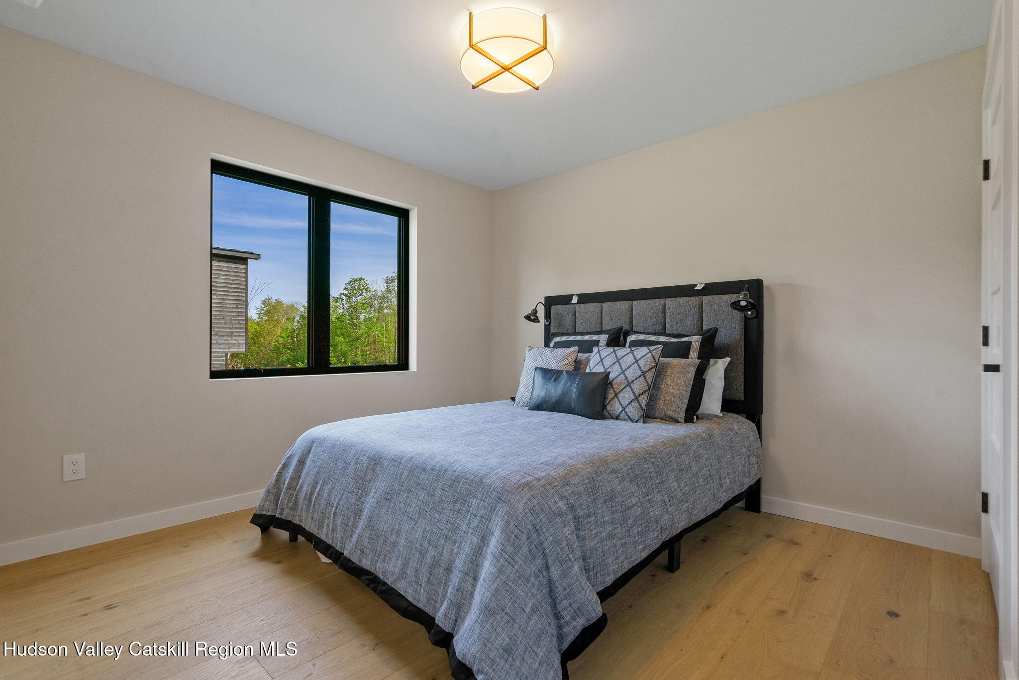 7773 Main Street Hunter, NY 12442 - Photo 11 of 18 a bedroom with a bed and window