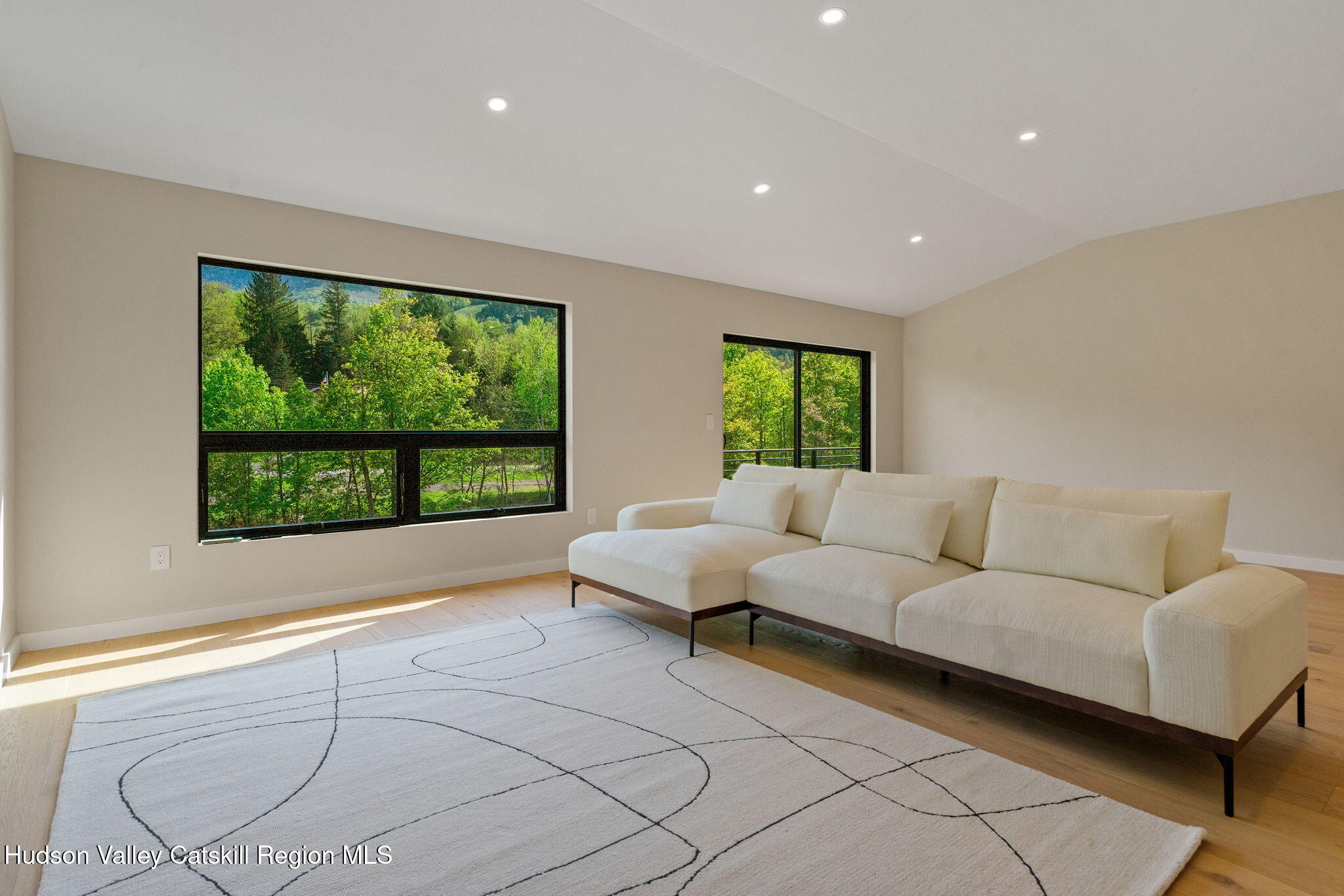 7773 Main Street Hunter, NY 12442 - Photo 13 of 18 a living room with furniture and large windows