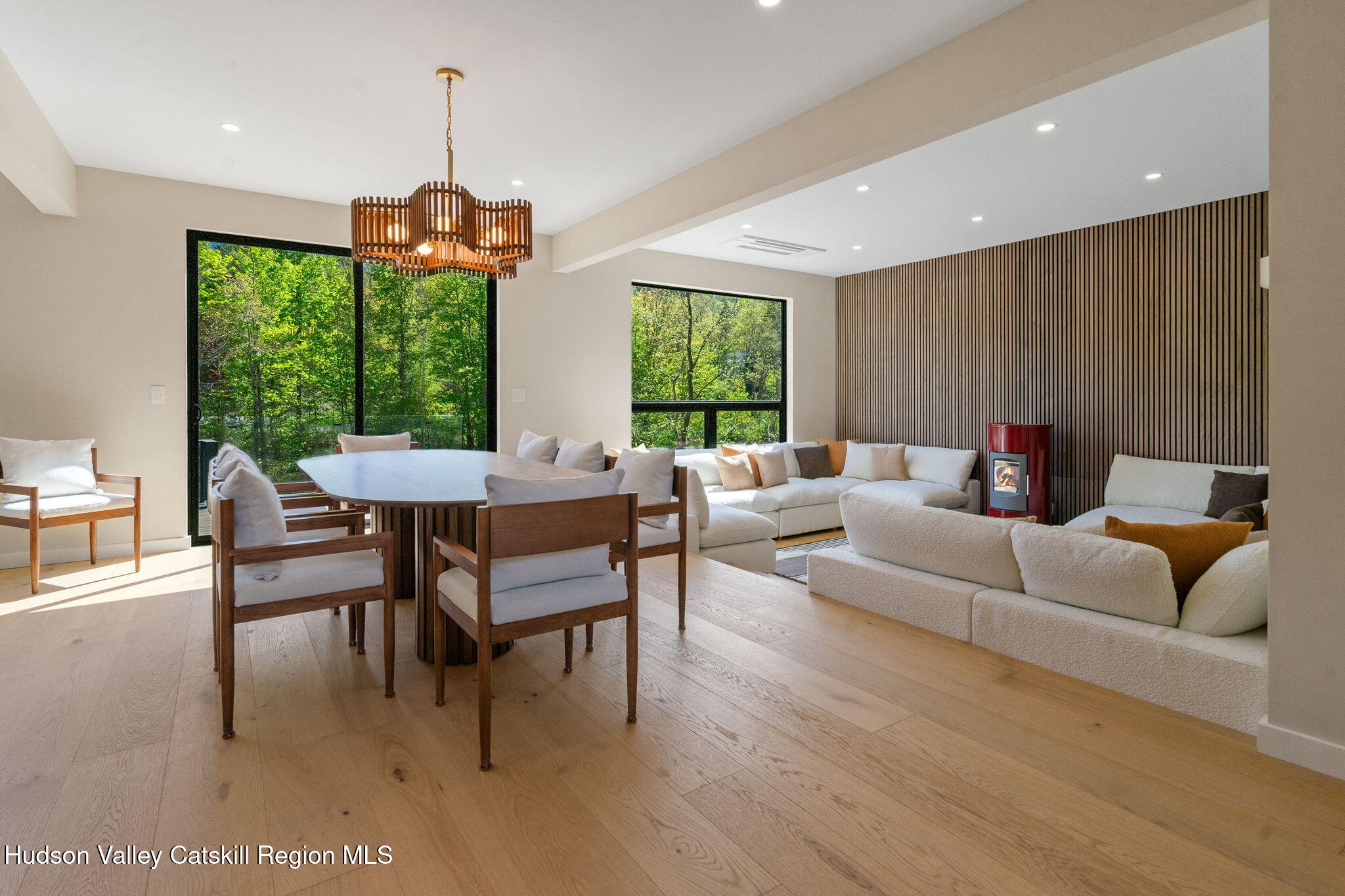 7773 Main Street Hunter, NY 12442 - Photo 3 of 18 a living room with furniture and a chandelier