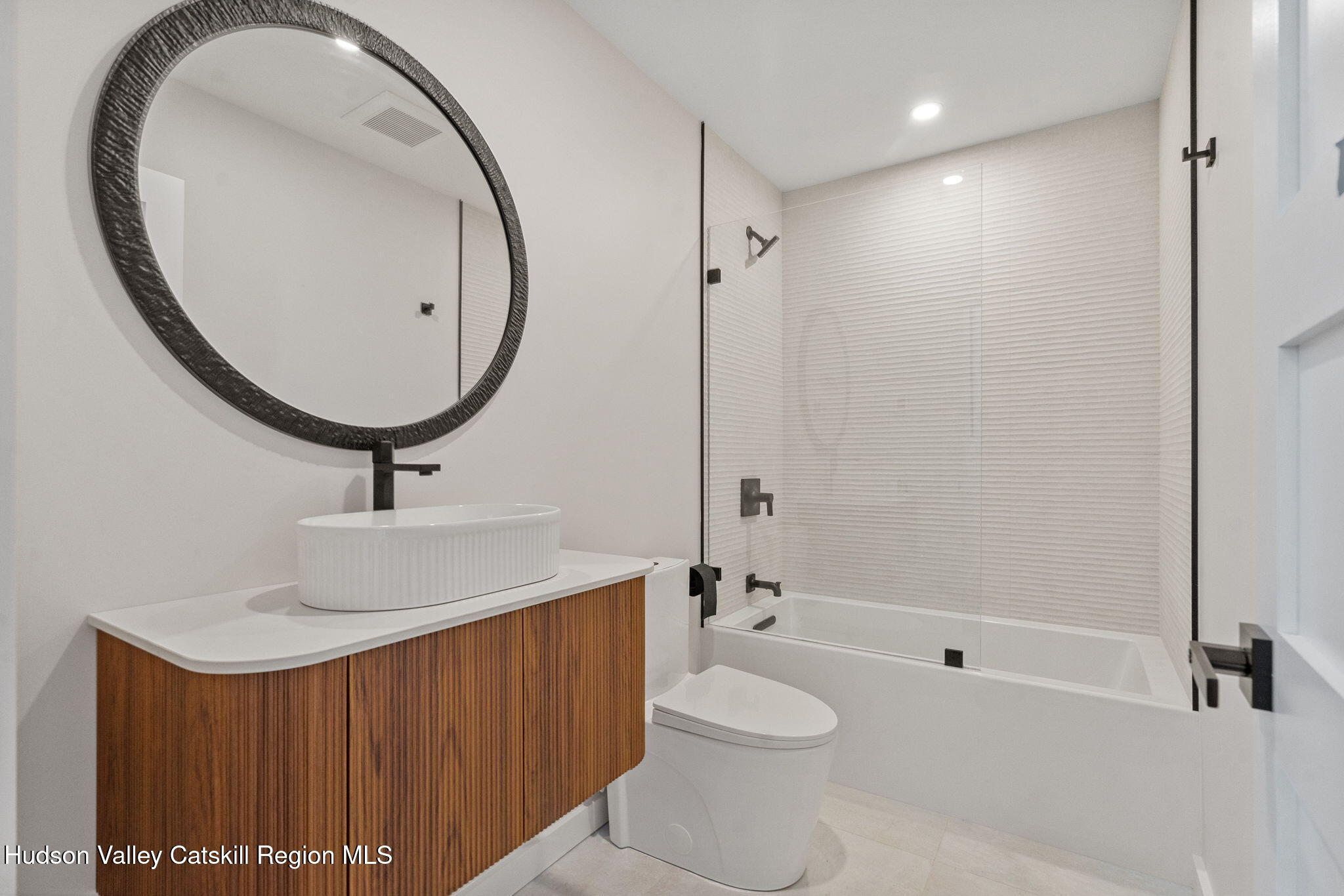 7773 Main Street Hunter, NY 12442 - Photo 10 of 18 a bathroom with a sink a toilet and shower