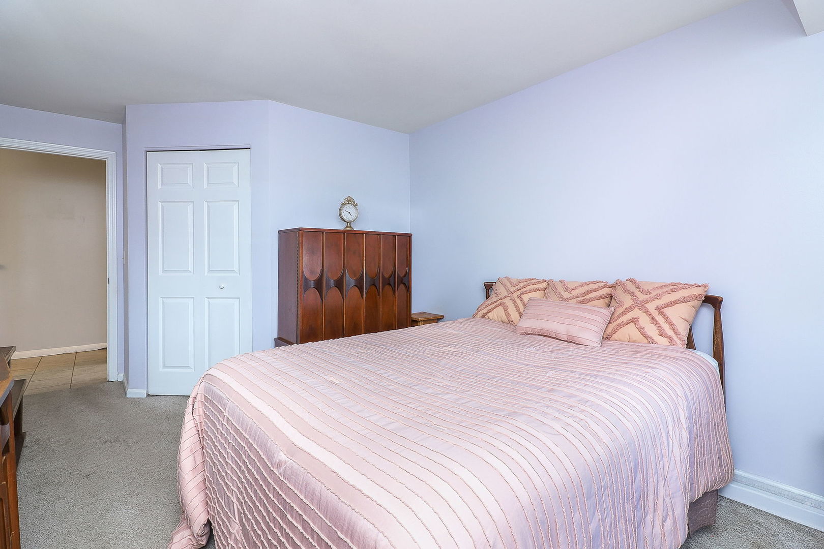 726 North Gary Avenue, Unit 109A Carol Stream, IL 60188 - Photo 11 of 22 a bedroom with a bed and a closet