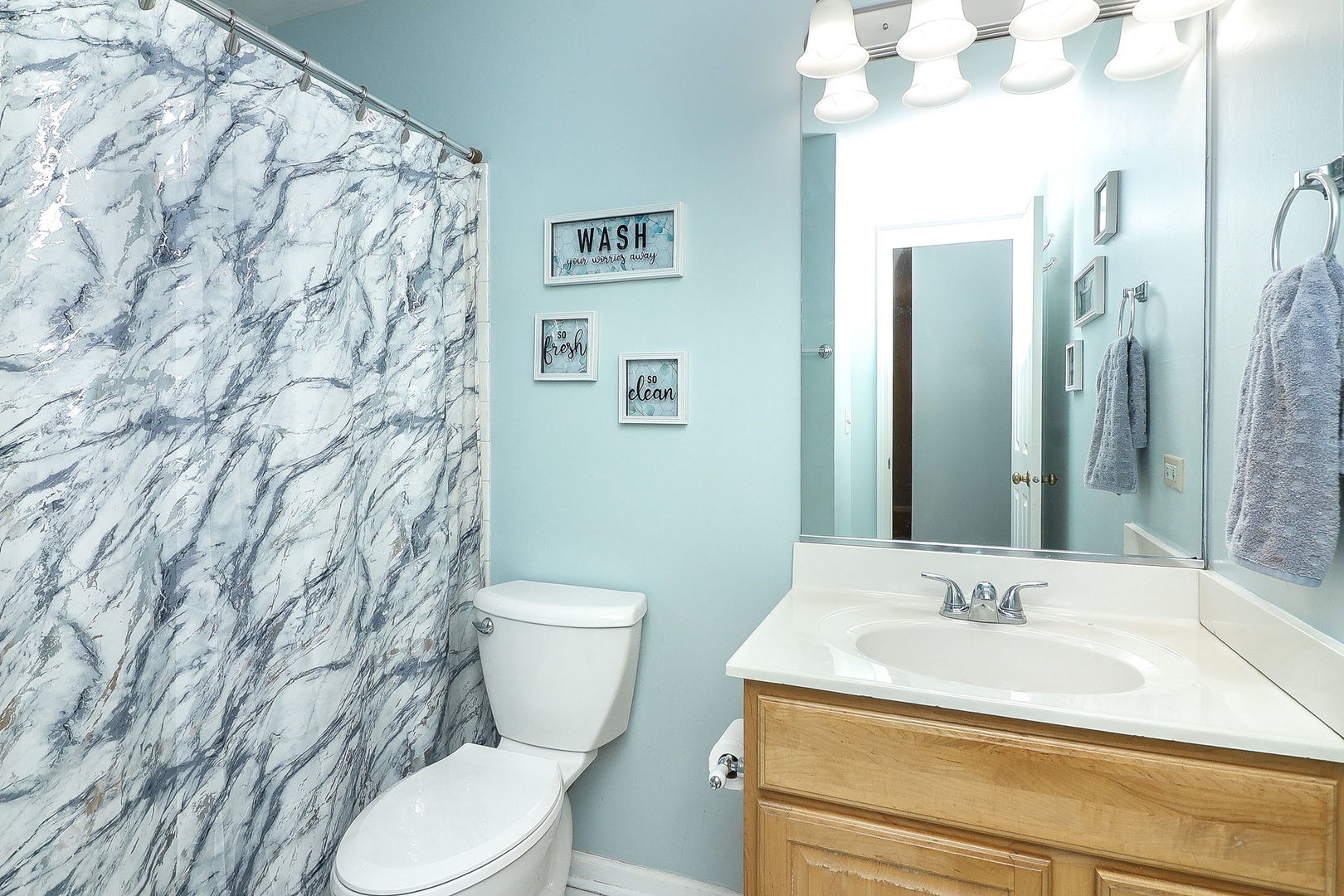 726 North Gary Avenue, Unit 109A Carol Stream, IL 60188 - Photo 12 of 22 a bathroom with a sink and a toilet