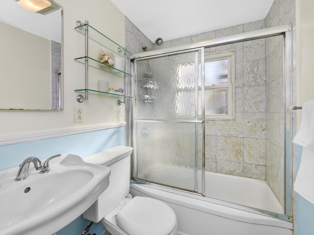 28 Truman Road Newton, MA 02459 - Photo 12 of 26 a bathroom with a shower and a sink