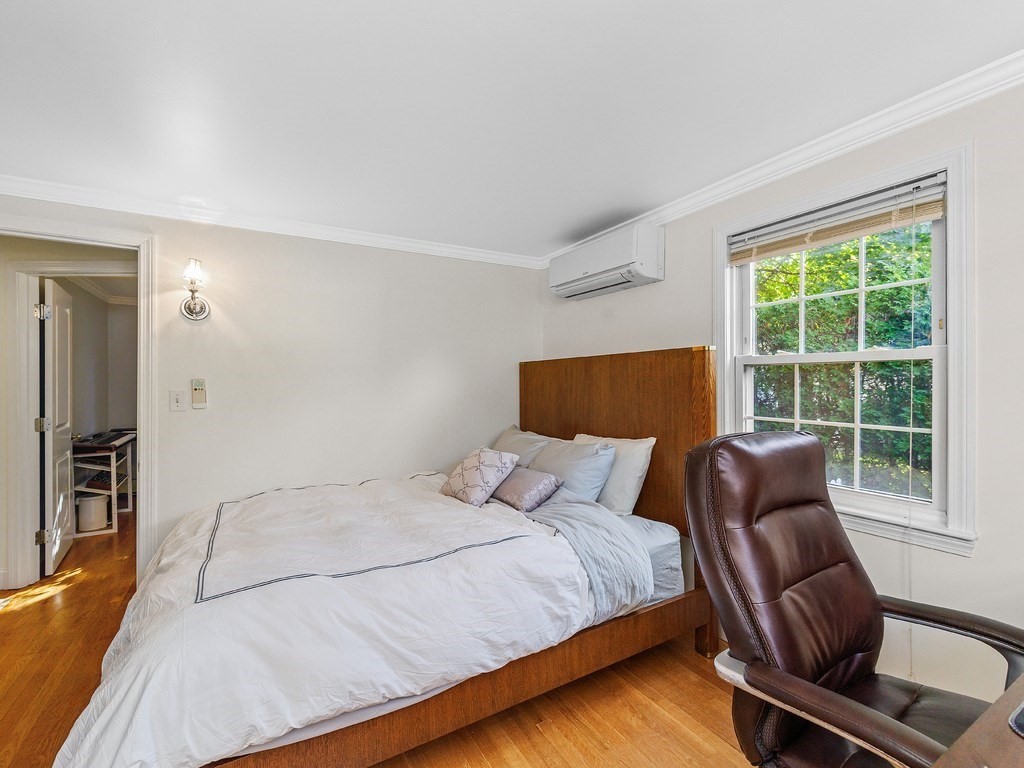 28 Truman Road Newton, MA 02459 - Photo 13 of 26 a bedroom with a bed and a chair with the outer view