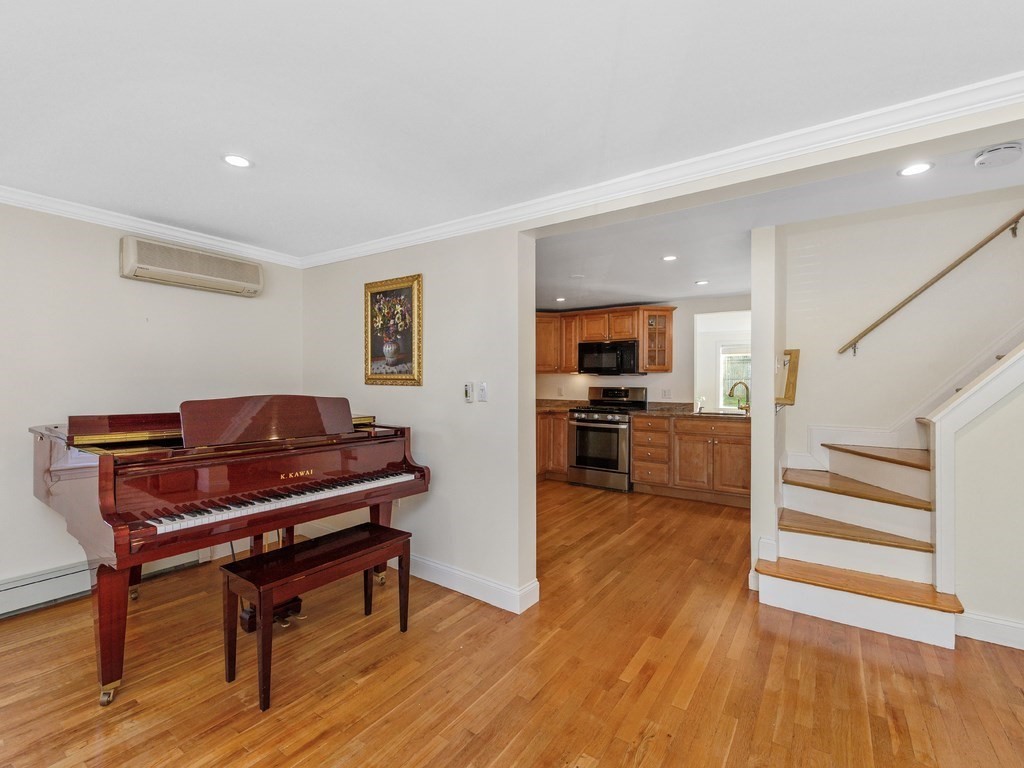 28 Truman Road Newton, MA 02459 - Photo 15 of 26 a living room with furniture and a wooden floor