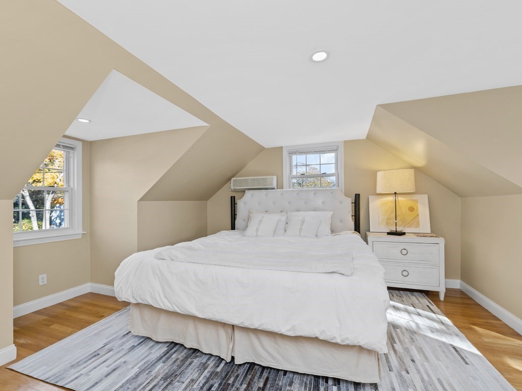 28 Truman Road Newton, MA 02459 - Photo 16 of 26 a bedroom with a bed and wooden floor