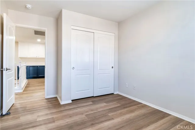 an empty room with wooden floor