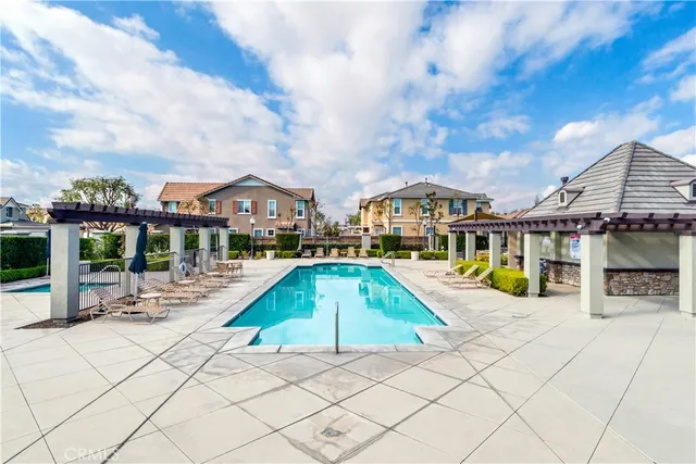a view of a swimming pool with a lounge chairs