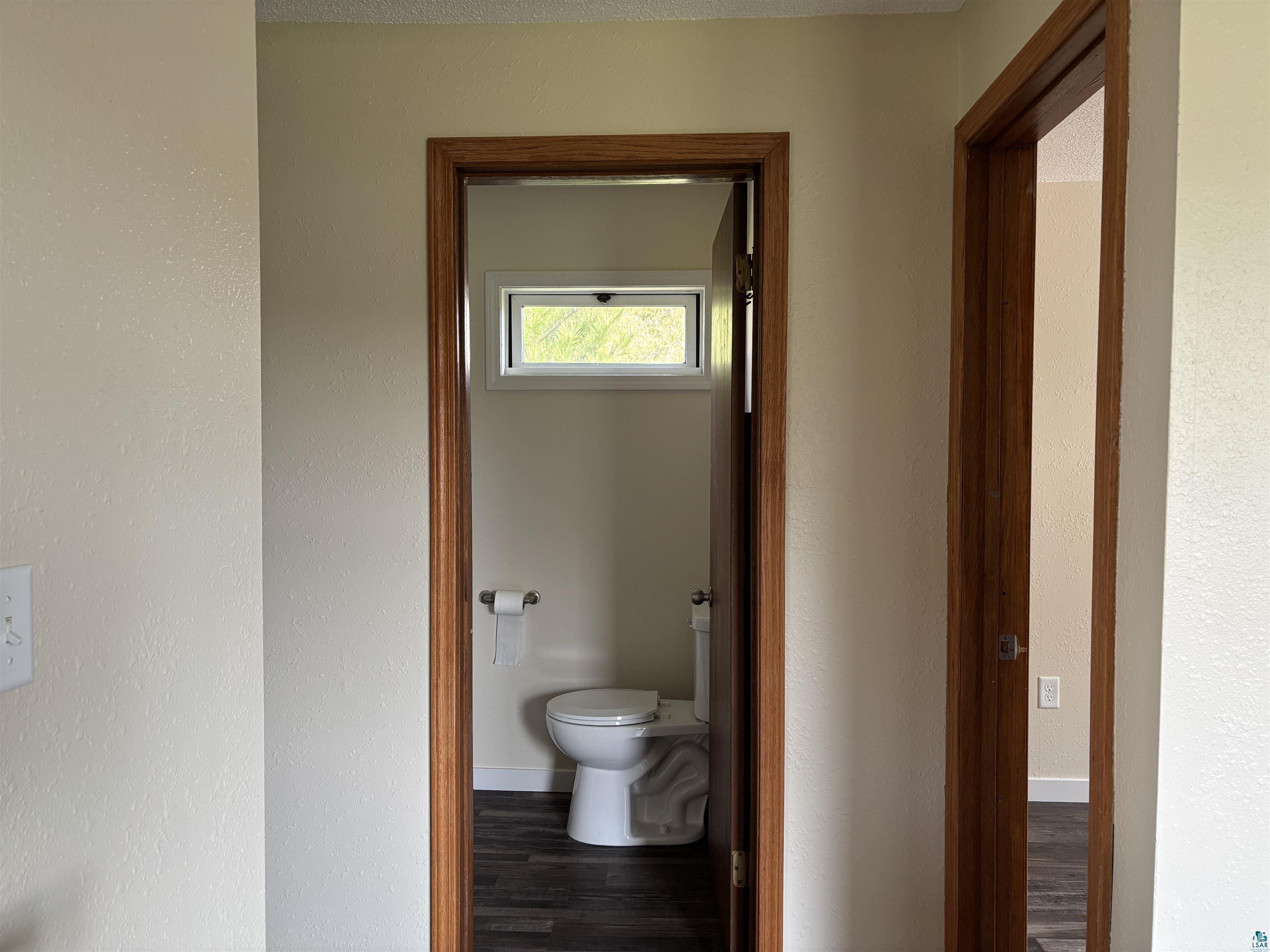 408 Midway Avenue Proctor, MN 55810 - Photo 18 of 20 Corridor with wood finished floors and baseboards