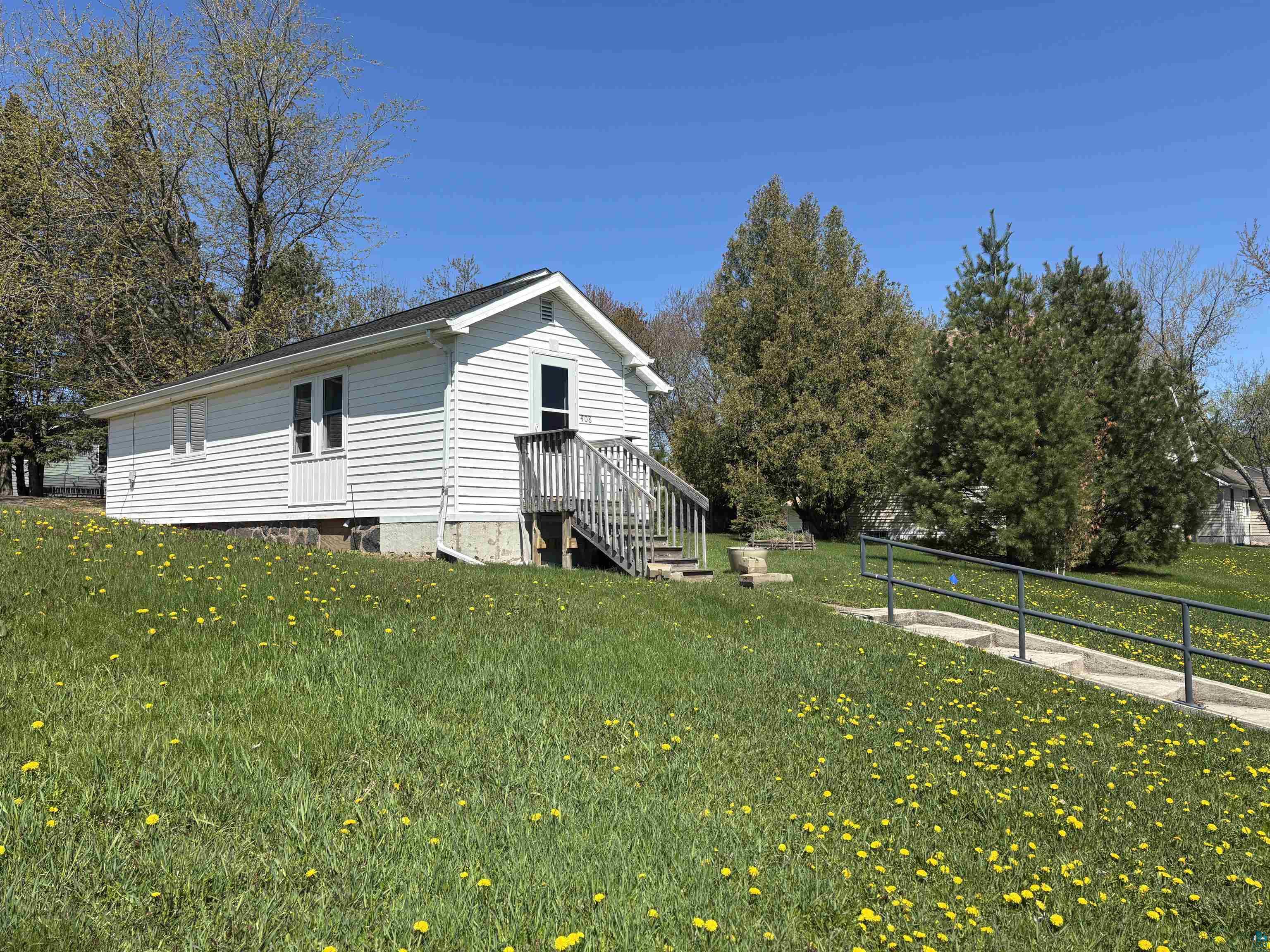 408 Midway Avenue Proctor, MN 55810 - Photo 2 of 20 View of side of home featuring a lawn