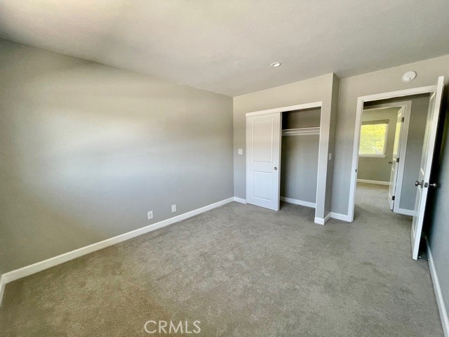 4641 Larwin Avenue Cypress, CA 90630 - Photo 5 of 18 an empty room with closet and mirror