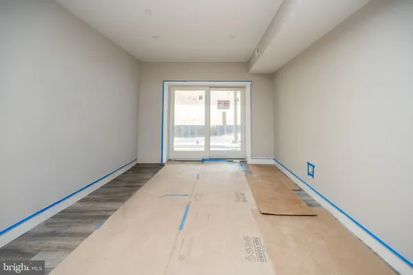 a view of a room with a white bed