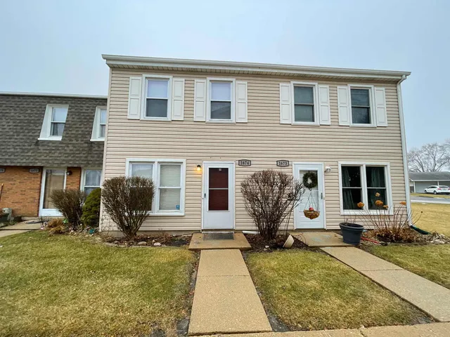 front view of a house with a patio