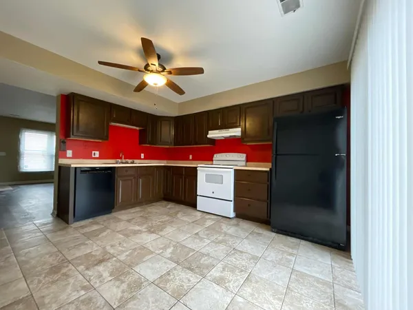 a kitchen with a cabinets and window