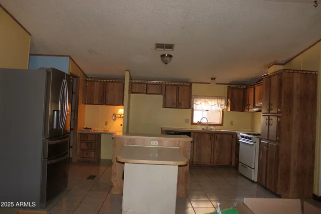 a bedroom with a cabinet and a shower curtain