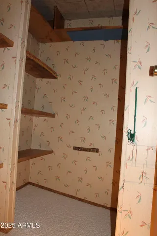 an empty room with an entrance door