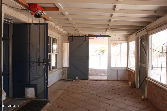 a kitchen with a stove and a wooden floor