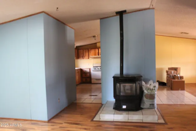 a kitchen with a stove a sink and a refrigerator