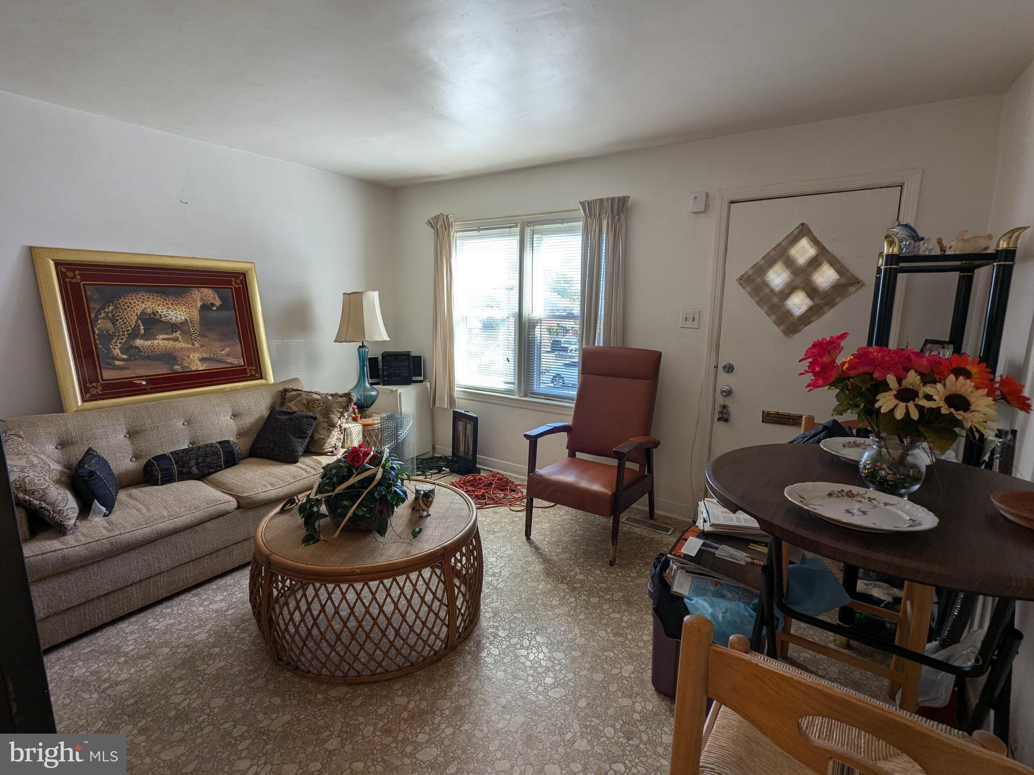 504 Bridgeview Road Baltimore, MD 21225 - Photo 3 of 12 a living room with furniture a rug and a window