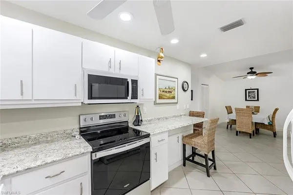 a kitchen with a stove and a microwave