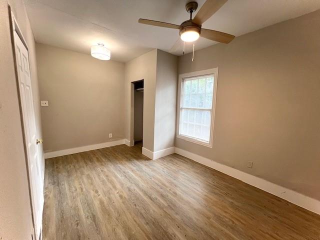 425 Grandview Avenue Dallas, TX 75223 - Photo 13 of 25 wooden floor in an empty room with a window