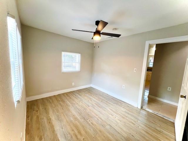 425 Grandview Avenue Dallas, TX 75223 - Photo 14 of 25 a view of empty room with wooden floor and fan