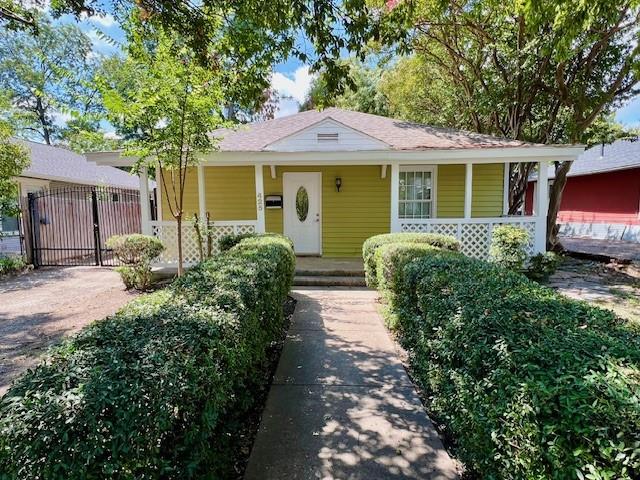 425 Grandview Avenue Dallas, TX 75223 - Photo 2 of 25 a front view of a house with garden