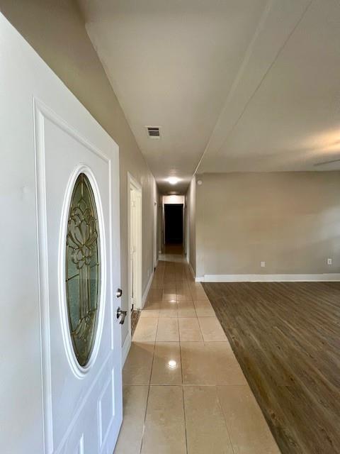 425 Grandview Avenue Dallas, TX 75223 - Photo 3 of 25 a view of a hallway with painted walls