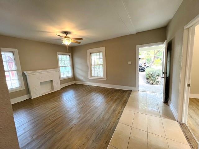 425 Grandview Avenue Dallas, TX 75223 - Photo 5 of 25 a view of an empty room with window and wooden floor