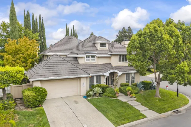 a living room with furniture fireplace and a large window