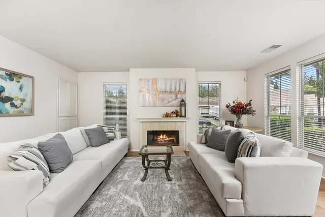 a view of a dining room with furniture wooden floor and chandelier