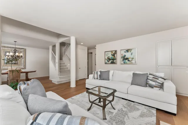 a kitchen with stainless steel appliances granite countertop a sink stove refrigerator and microwave