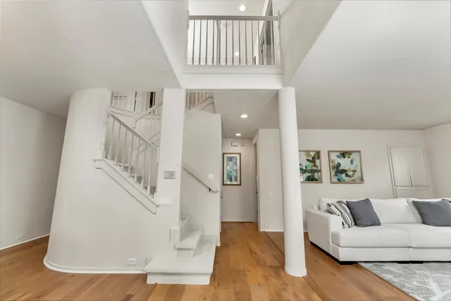 a view of a chair and tables in the balcony