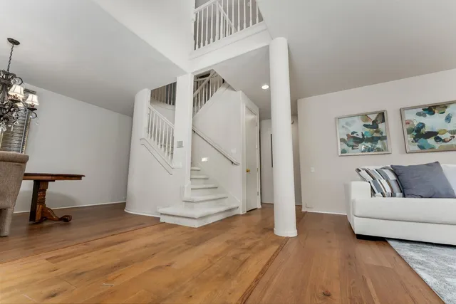 a backyard of a house with lots of green space and fountain