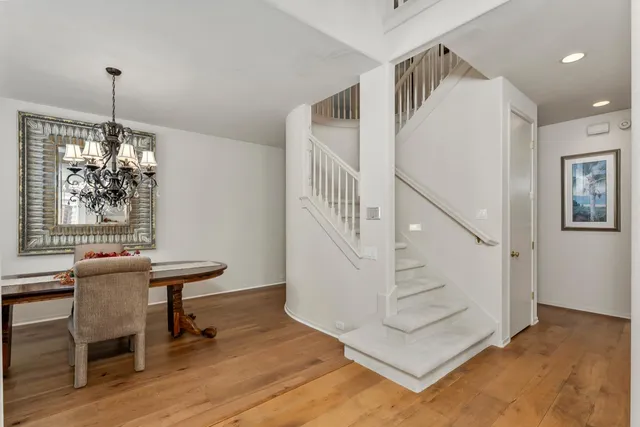 a view of a chairs and table in a backyard