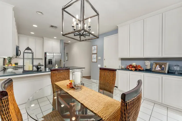 an aerial view of a house with garden space and street view