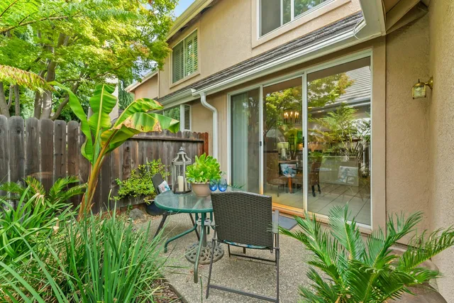 a view of a chairs and table in the patio