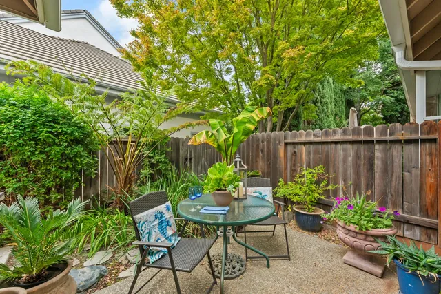 a view of a lake with boats and trees in the background