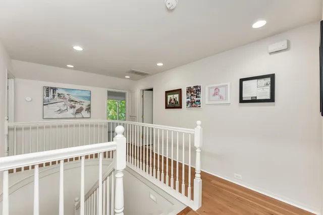 a view of a house with a garden and trees