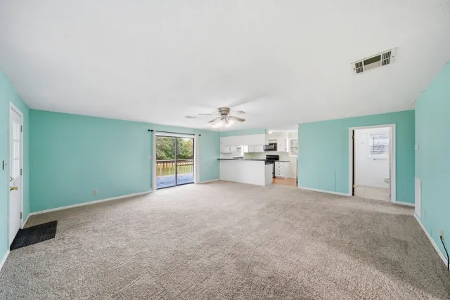 a view of a big room with windows and cabinet