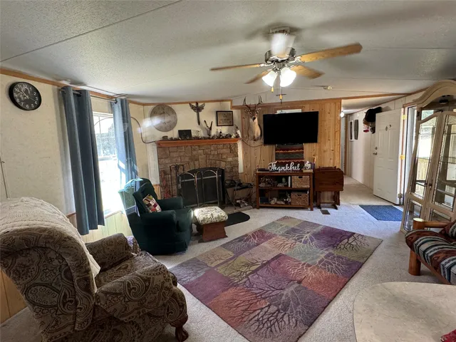 a view of a deck with wooden floor and outdoor seating